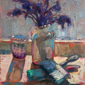 Still life painting with purple flowers in a white vase, brushes and a glass, illuminated by the sunlight