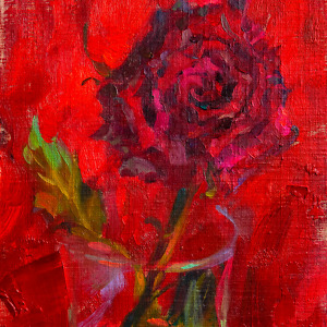 A crimson rose blooming against a scarlet canvas