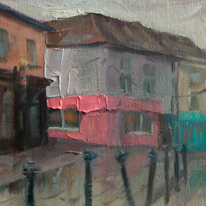 Rainy Day on a Street Lined with Pink and Turquoise Houses