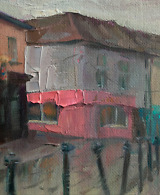 Rainy Day on a Street Lined with Pink and Turquoise Houses